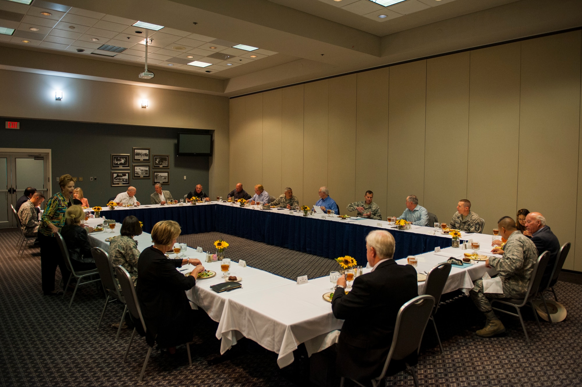 Attendees eat together at the Civic Leader Luncheon of 2018 at the Event Center on Goodfellow Air Force Base, Texas, March 28, 2018. Discussions during the luncheon included topics surrounding the International Intelligence Training Center, on-going projects throughout the base, and how mission growth is occurring on Goodfellow. (U.S. Air Force photo by Senior Airman Scott Jackson/Released)