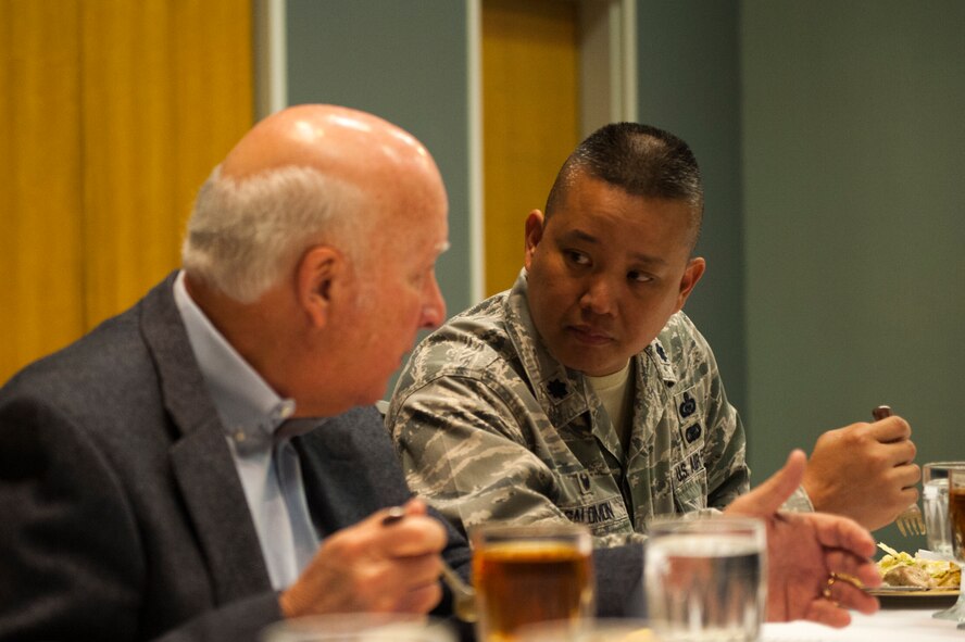 U.S. Air Force Lt. Col. Abraham Salomon, 17th Training Squadron commander, talks with honorary commander to the 315th Training Squadron, Jim Hughes, during the civic leader luncheon of 2018 at the Event Center on Goodfellow Air Force Base, Texas, March 28, 2018. Commanders and civic leaders all sat next to each other maintaining communication. (U.S. Air Force photo by Senior Airman Scott Jackson/Released)