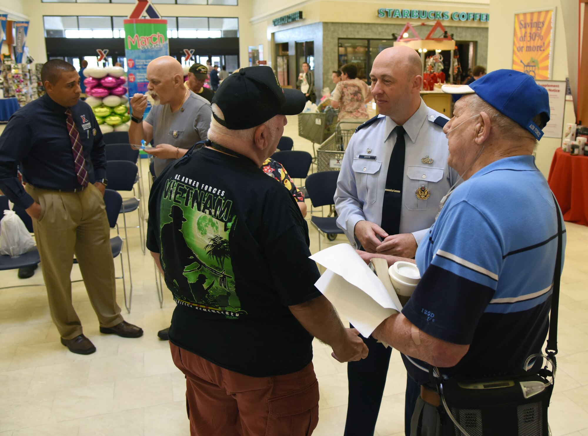 U.S. Air Force Col. Danny Davis, 81st Mission Support Group commander, speaks to Vietnam veterans during the 50th Anniversary Vietnam Memorial Pinning Day at The Exchange March 29, 2018, on Keesler Air Force Base, Mississippi. The event, which included a cake cutting ceremony and commemorative lapel pin presentation, was held to honor Vietnam veterans for their service. (U.S. Air Force photo by Kemberly Groue)
