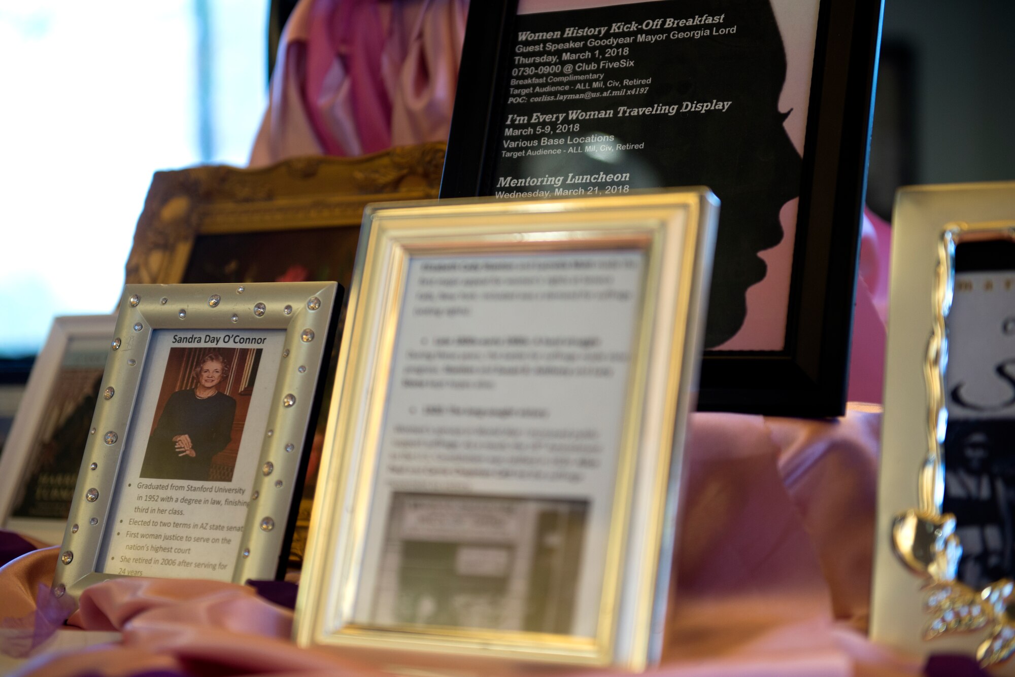 A display exhibits excerpts of women's history at the Women's Mentoring Panel luncheon Mar. 21, 2018, at Luke Air Force Base, Ariz. The panel honored Women's History Month by allowing accomplished women from Luke to speak about their experiences and share stories of overcoming challenges. (U.S. Air Force photo by Senior Airman Ridge Shan)