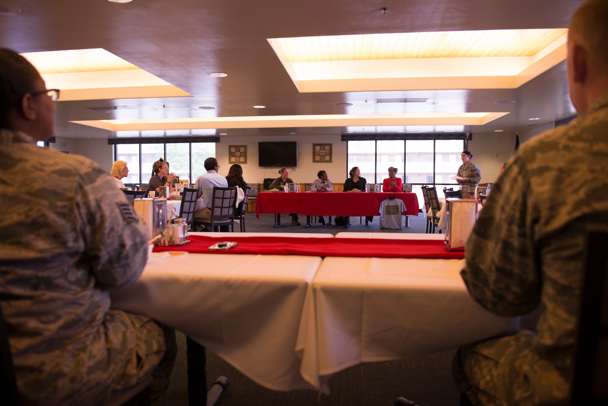 Lt. Col. Kathryn Gaetke, 309th Fighter Squadron commander, Chief Master Sgt. Marjon Robertson, 56th Fighter Wing Inspector General superintendent, Lauren Pierce, 607th Air Control Squadron key spouse, and Melody Dameron-Ellis, 56th Medical Group medical support assistant, prepare to speak from the central table while Staff Sgt. Kristina Permont, Women's History Month Committee spokesperson, introduces them during the Women's Mentoring Panel Mar. 21, 2018, at Luke Air Force Base, Ariz. The panel honored women's accomplishments during Women's History Month. (U.S. Air Force photo by Senior Airman Ridge Shan)