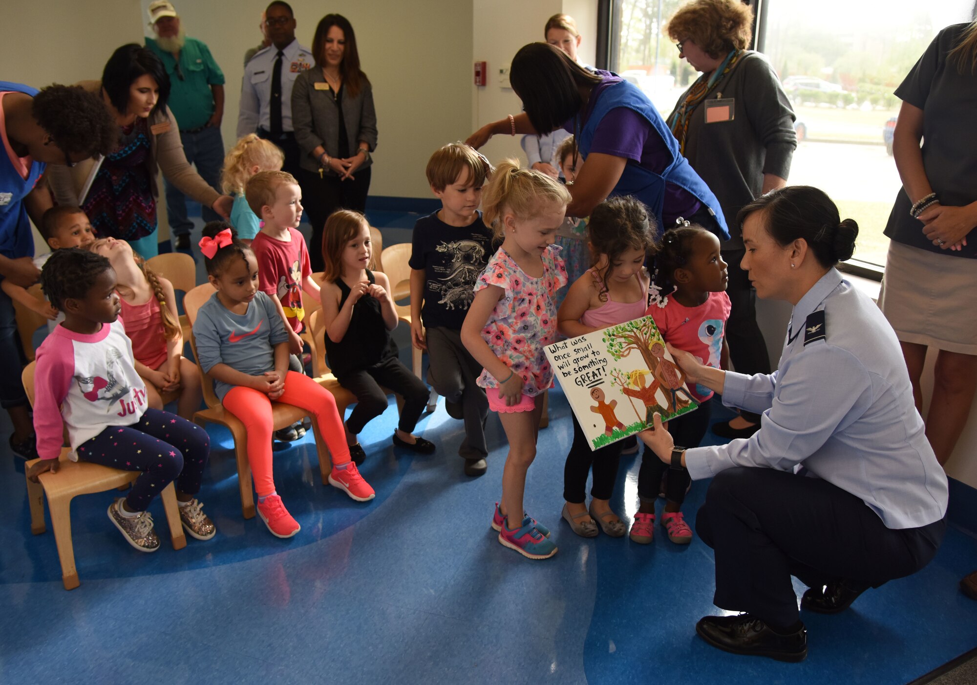 U.S. Air Force Col. Debra Lovette, 81st Training Wing commander, looks at art work during the Arbor Day Ceremony at the Keesler Child Development Center March 29, 2018, on Keesler Air Force Base, Mississippi. Arbor Day is a nationally celebrated observance that focuses on environmental issues and ways to improve the environment. The event included the reading of the Arbor Day Proclamation and a Tree City USA award presentation. (U.S. Air Force photo by Kemberly Groue)