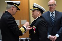 Rear Adm. Tom Druggan, commander, Naval Surface Warfare Center, is relieved by Donald McCormack, executive director, Naval Sea Systems Command, Naval Surface and Undersea Warfare Centers, as director during an official change of office ceremony at the Washington Navy Yard, March 29, 2018.