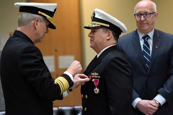 Rear Adm. Tom Druggan, commander, Naval Surface Warfare Center, is relieved by Donald McCormack, executive director, Naval Sea Systems Command, Naval Surface and Undersea Warfare Centers, as director during an official change of office ceremony at the Washington Navy Yard, March 29, 2018.