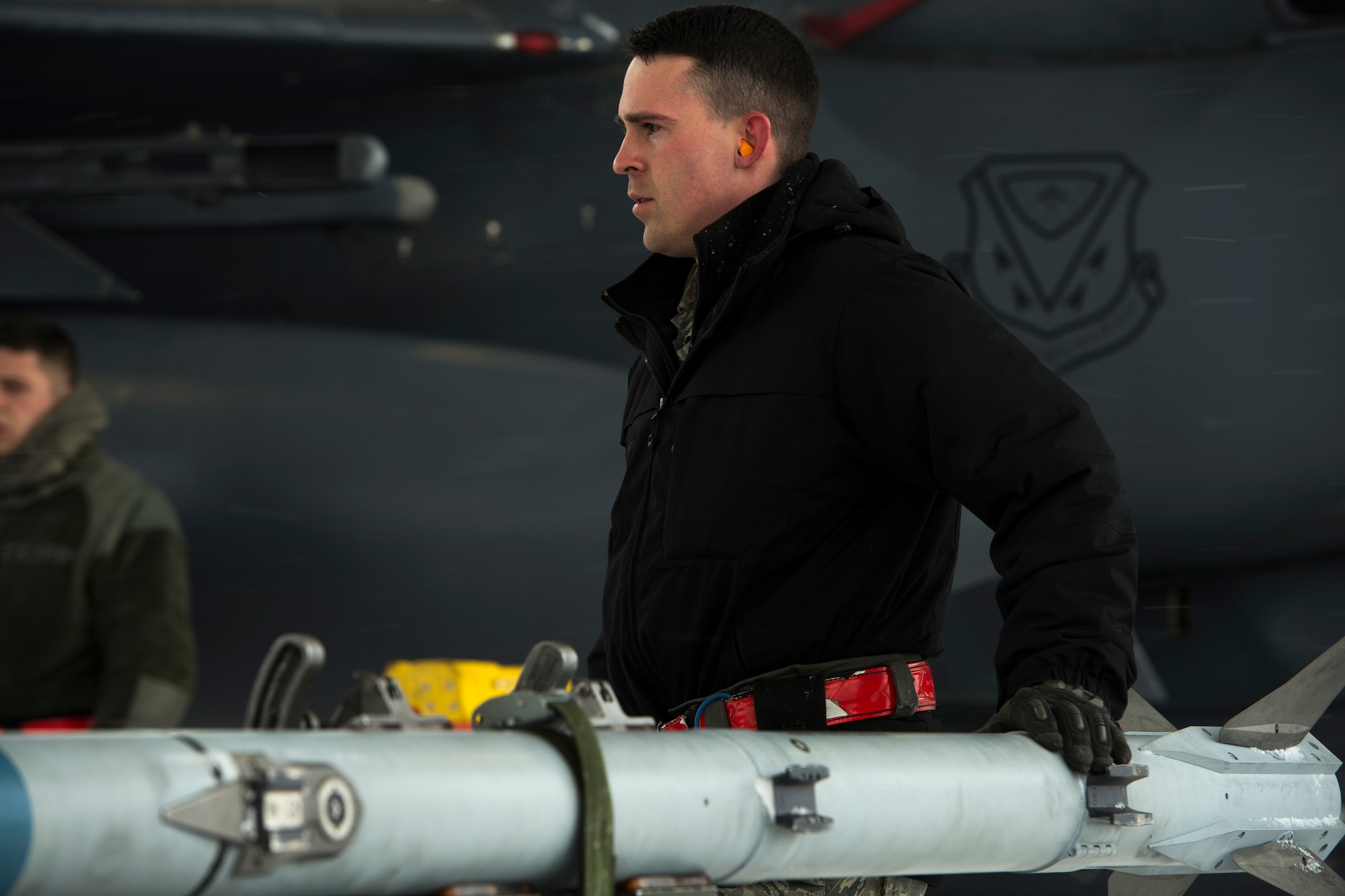 Staff Sgt. Cameron Delsol, 366th Maintenance Squadron weapons loadcrew team chief, prepares an AIM-9X Sidewinder to load onto an F-15E Strike Eagle March 1, 2018, at Mountain Home Air Force Base, Idaho. The AIM-9X is a short-range, air-to-air missile that will increase pilots abilities to track their enemies.