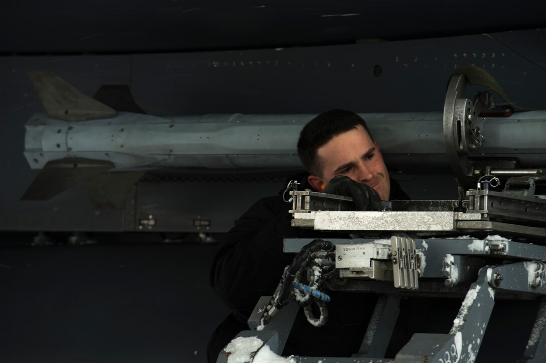 Staff Sgt. Cameron Delsol, 366th Maintenance Squadron weapons loadcrew team chief, locks an AIM-9X Sidewinder onto an F-15E Strike Eagle March 1, 2018, at Mountain Home Air Force Base, Idaho. The AIM-9X is a short-range, air-to-air missile that will increase pilots abilities to track their enemies.