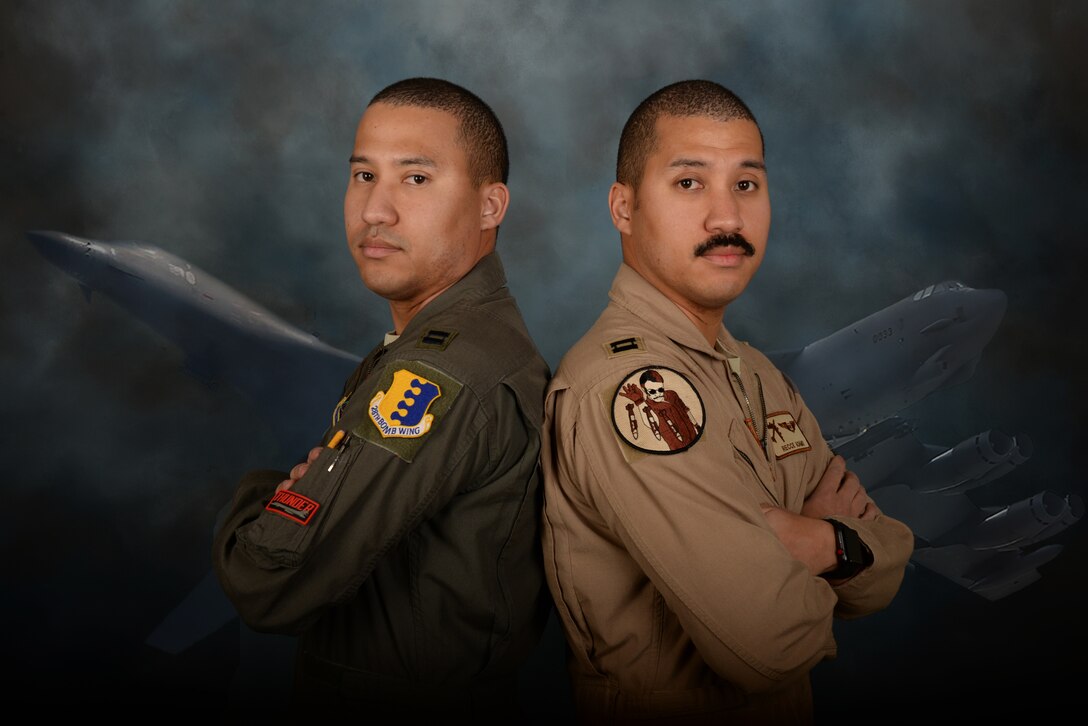 Capt. Julien Adams, a B-1 Lancer weapon systems officer assigned to the 34th Bomb Squadron at Ellsworth Air Force Base, S.D., and Capt. Daniel Adams, a B-52 Stratofortress weapon systems officer assigned to the 69th BS at Minot AFB, N.D., stand back to back at Ellsworth AFB, Feb. 10, 2018. The Adams brothers are identical twins whose career paths have led them to have similar backgrounds in the same major command. (U.S. Air Force photo illustration by Airman 1st Class Nicolas Z. Erwin)
