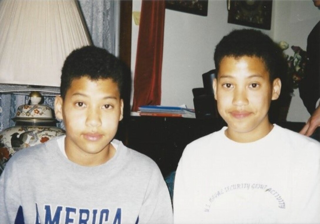 Julien and Daniel Adams pose together at their home in Japan in the mid-1990s. The brothers now serve as U.S. Air Force captains. Julien is a B-1 Lancer weapon systems officer assigned to the 34th Bomb Squadron at Ellsworth Air Force Base, S.D., and Daniel is a B-52 Stratofortress weapon systems officer assigned to the 69th BS at Minot AFB, N.D. The Adams brothers spent their childhood and adolescent years stationed in Japan due to their father being in the U.S. Marine Corps. (Courtesy photo)