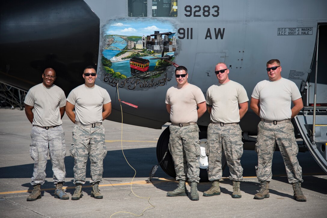 A group of Airmen from the 911th Maintenance Squadron, based out of Pittsburgh International Airport Air Reserve Station, Pennsylvania, stand in front of an HC-130P/N Combat King at Patrick Air Force Base, Florida, Mar. 1, 2018. The squadron is currently staged here to inspect their aircraft which are returning from overseas assignments, while their base readies for the transition to a new airframe. (U.S. Air Force photo/Staff Sgt. Jared Triamrchi)