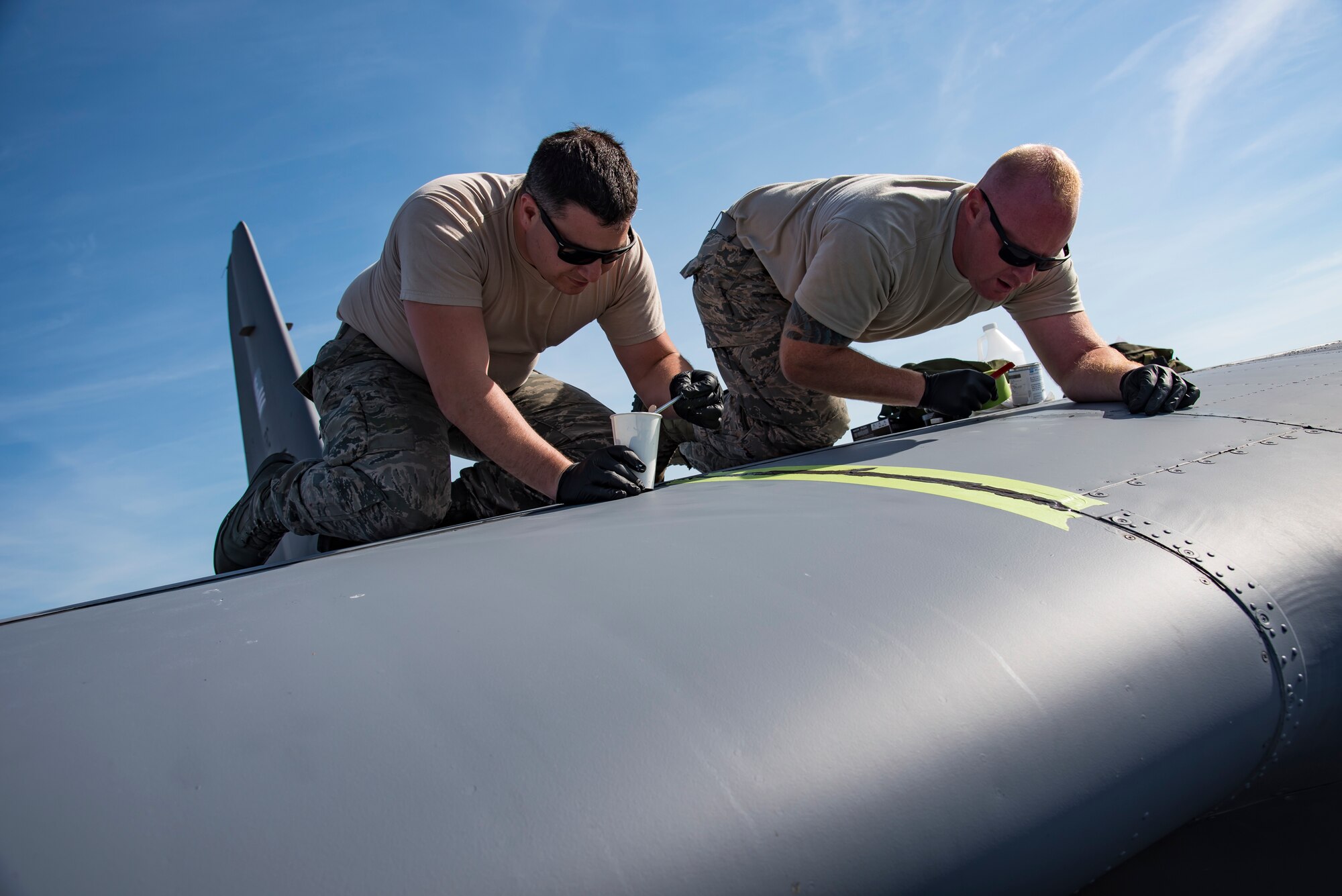 Airmen from the 911th Maintenance Squadron, based out of Pittsburgh International Airport Air Reserve Station, Pennsylvania, ensure there are no leaks on an HC-130P/N Combat King at Patrick Air Force Base, Florida, Mar. 1, 2018. The squadron is currently staged here to inspect their aircraft which are returning from overseas assignments, while their base readies for the transition to a new airframe. (U.S. Air Force photo/Staff Sgt. Jared Triamrchi)