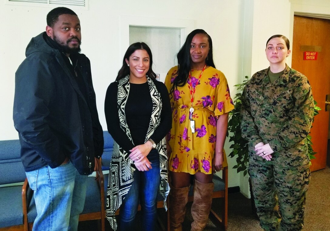 Personal Property Office (PPO) employees from left to right: Warren Holmes, Melinda Rogers, Romelia Allen and Gunnery Sgt. Catherine Wilcher.