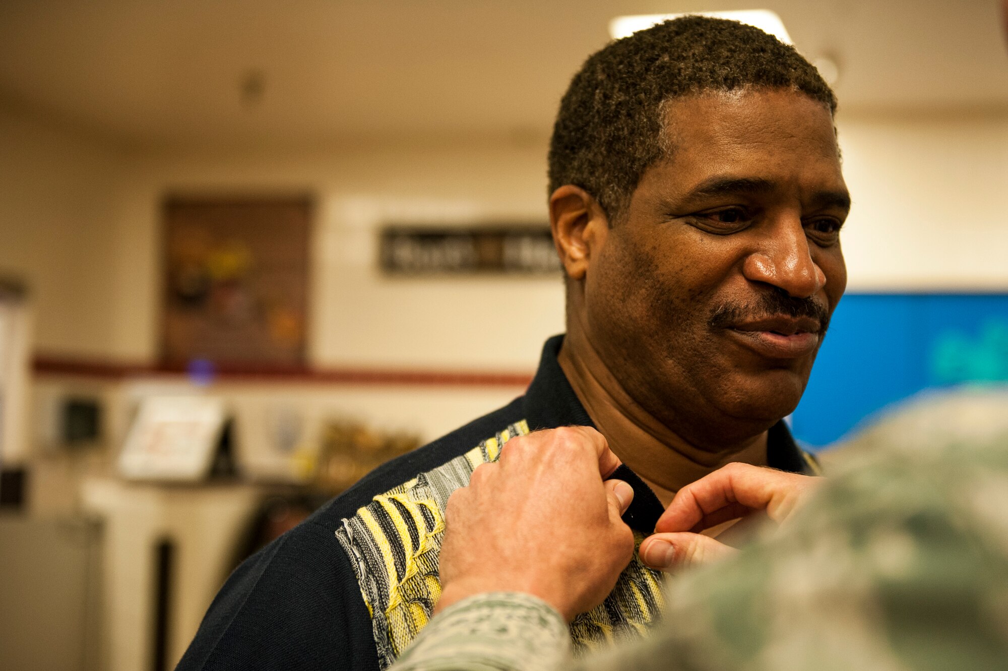 Marine Corps veteran, Gary Jenkins, receives a Vietnam recognition pin from U.S. Air Force Col. Jason Beck, 17th Mission Support Group commander, during a ceremony at the Commissary on Goodfellow Air Force Base, Texas, March 29, 2018. Beck thanked each of them for their service and said he felt honored for being able to present the pins.