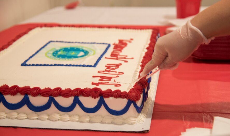 Amber Meza, volunteer coordinator for Moody Air Force Base, cuts the cake at an American Red Cross volunteer appreciation luncheon, March 26, 2018, at Moody Air Force Base, Ga. Volunteers from Moody were recognized for their service to the American Red Cross. (U.S. Air Force photo by 1st Lt. Kaitlin Toner)