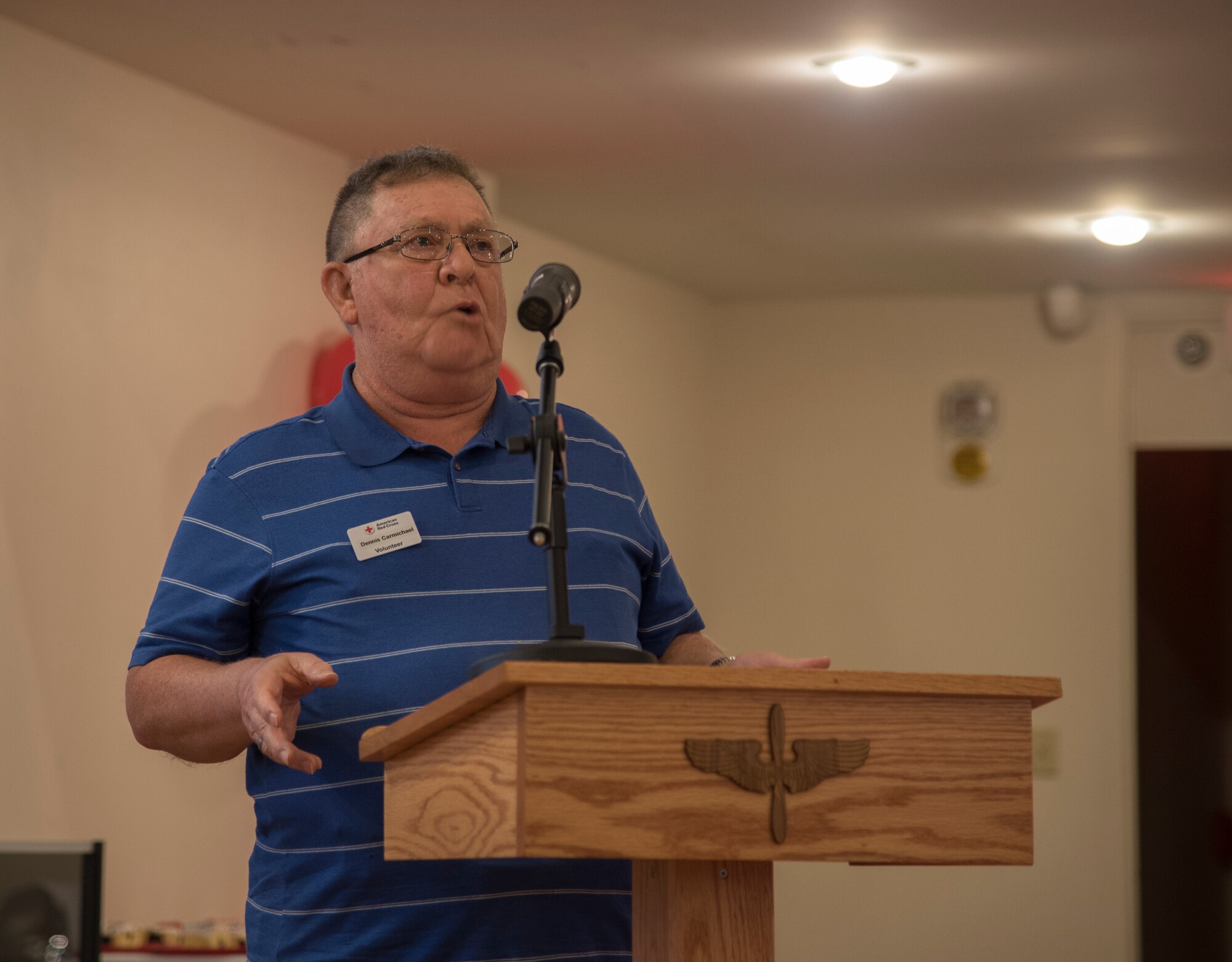 Dennis Charmichael, an American Red Cross volunteer, shares his story at the American Red Cross volunteer appreciation luncheon, March 26, 2018, at Moody Air Force Base, Ga. Volunteers from Moody were recognized for their service to the American Red Cross. (U.S. Air Force photo by 1st Lt. Kaitlin Toner)