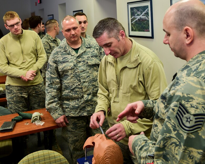 Tech. Sgt. Gary Baker Jr., a unit training manager with the 910th Medical Squadron, instructs 910th Airmen on how to insert a laryngeal tube during a Self Aid Buddy Care (SABC) class here.