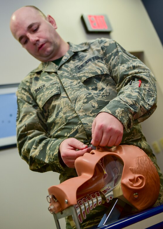 Tech. Sgt. Gary Baker Jr., a unit training manager with the 910th Medical Squadron, instructs 910th Airmen on how to insert a laryngeal tube during a Self Aid Buddy Care (SABC) class here.