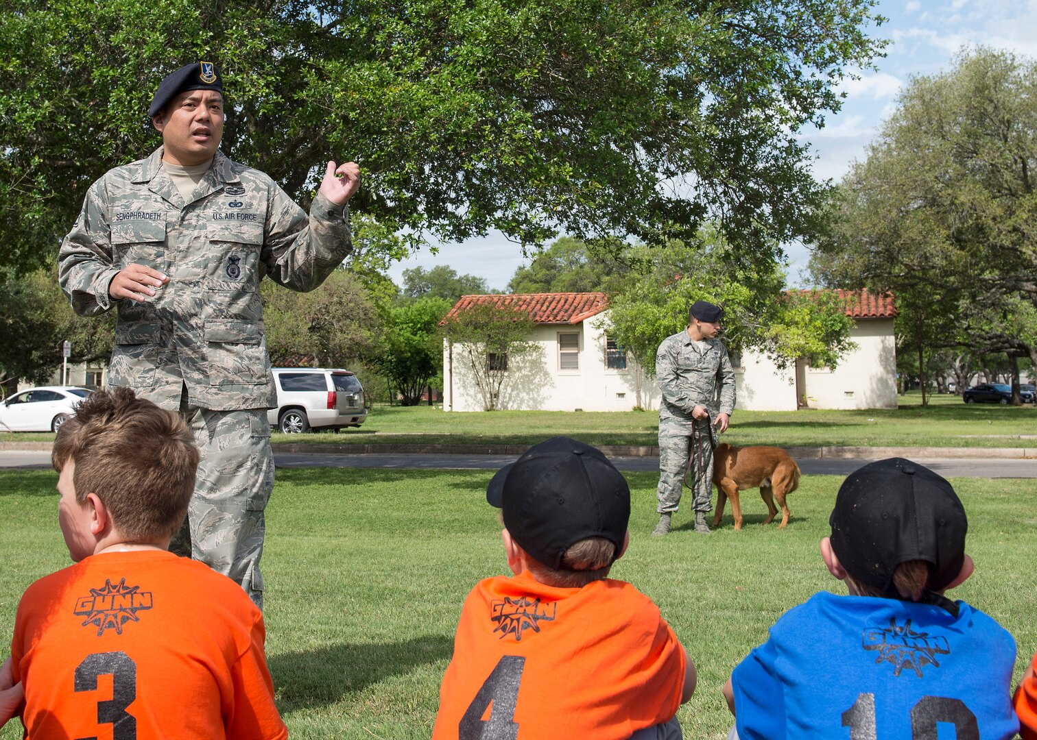 Staff Sgt. Michael Sengphradeth, 902nd Security Forces Squadron military working dog trainer, prepares to show a demonstration of the 902nd SFS MWDs during Joint Base San Antonio-Randolph’s 2016 Famaganza at the Youth Programs complex.