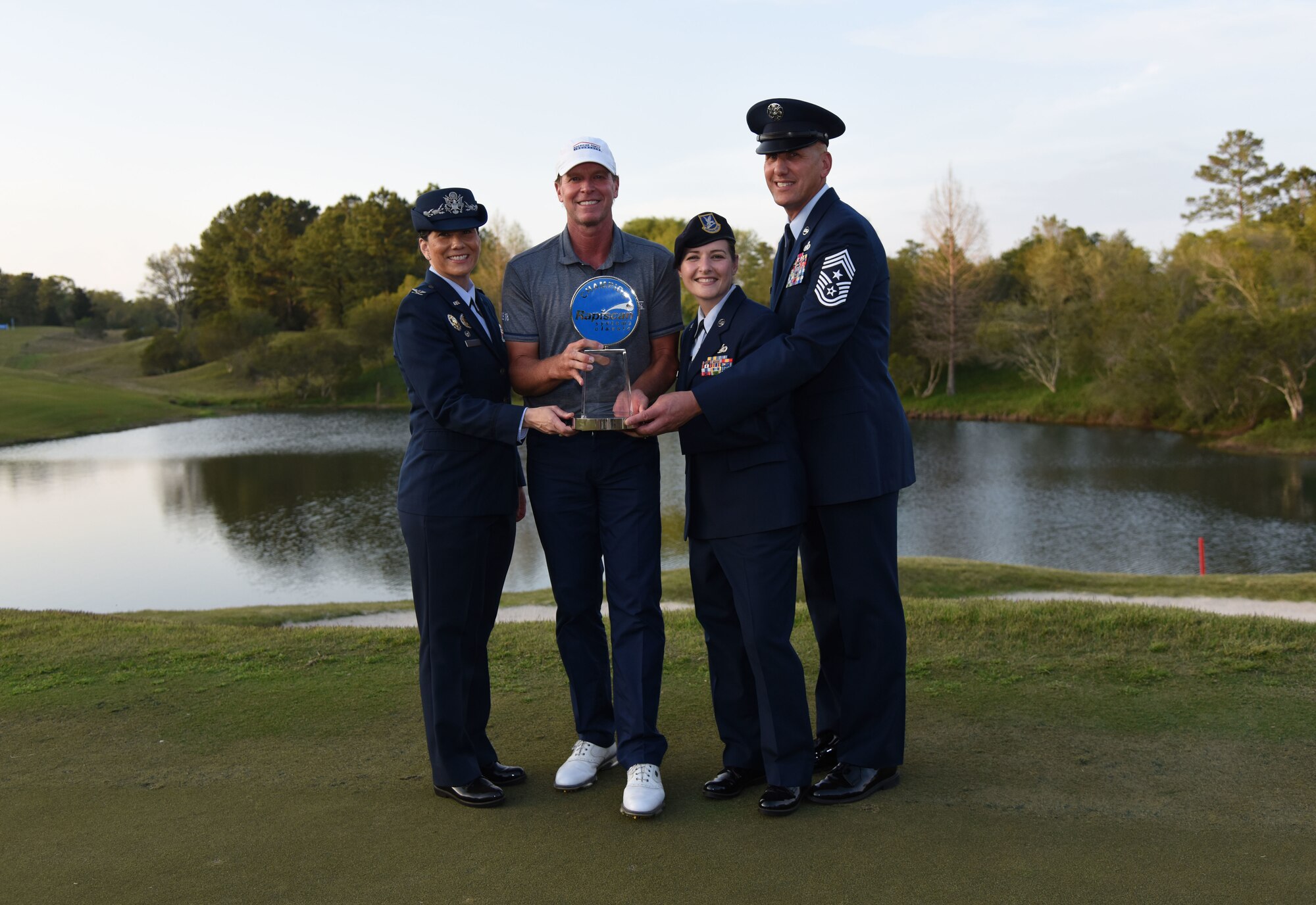 U.S. Air Force Col. Debra Lovette, 81st Training Wing commander, Tech. Sgt. Jennifer Watts, 81st TRW command chief executive assistant, and Chief Master Sgt. Kenneth Carter, Jr., 81st TRW command chief, pose for a photo with Steve Stricker, Professional Golfers’ Association golfer, after winning the Rapiscan Systems Classic Champions Tour at Fallen Oak Golf Club March 25, 2018, in Saucier, Mississippi. Keesler personnel performed the national anthem and presented the colors during the closing ceremony of the three-day event. (U.S. Air Force photo by Kemberly Groue)