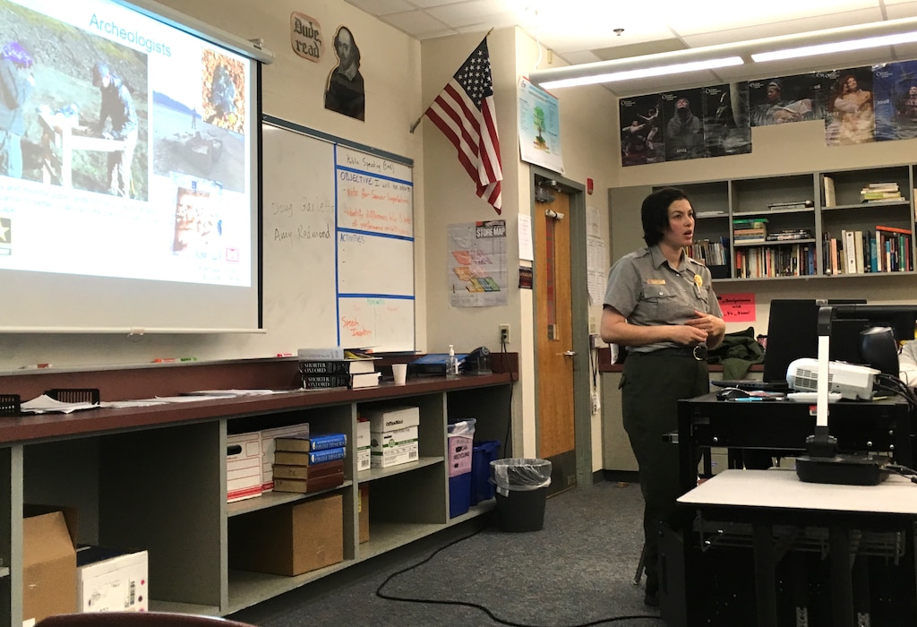 Amy Redmond, Portland District natural resource specialist, talks to Cottage Grove High School students during a college and career fair, March 21. Redmond and Doug Garletts, District fish biologist, attended the career day to highlight the various types of careers students could look forward to in the U.S. Army Corps of Engineers.