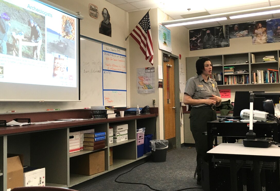 Amy Redmond, Portland District natural resource specialist, talks to Cottage Grove High School students during a college and career fair, March 21. Redmond and Doug Garletts, District fish biologist, attended the career day to highlight the various types of careers students could look forward to in the U.S. Army Corps of Engineers.