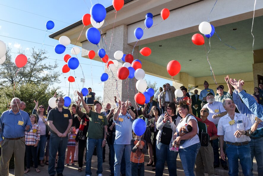 Vietnam veterans and their family members participate in the balloon launch before the ceremony commemorating the 50th anniversary of the Vietnam War at the LeGrand Alumni Center, San Angelo, Texas, March 29, 2018. Red balloons represented those who died in the Vietnam War, blue represented those who served, and white represented the still missing prisoners of war.