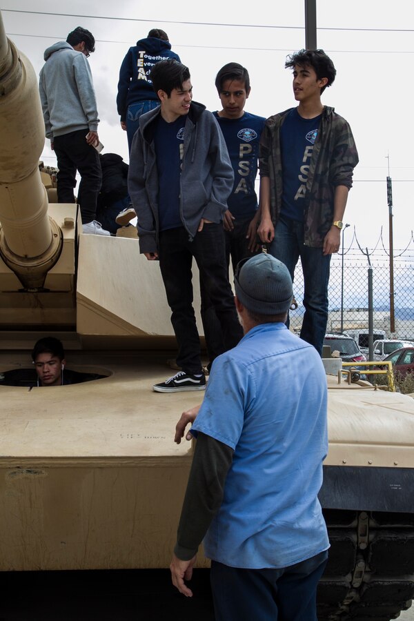 Students of the Desert Hot Springs High School Public Safety Academy learn about the M1A1 Abrams tank during their visit to the Exercise Support Division building aboard the Marine Corps Air Ground Combat Center, Twentynine Palms, Calif., March 22, 2018. (Official Marine Corps photo by Cpl. Dave Flores)