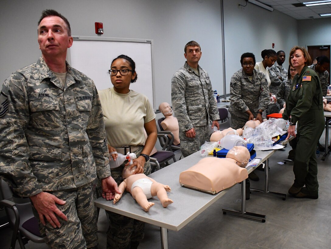Medical personnel listen to instructions for their next step in a basic life saving class.  The course is a refresher for most members of the 932nd Medical Group and 932nd Aeromedical Evacuation Squadron seen here.  The instructor and demonstration video combination explained the intricate methods for taking care of babies and small children during this class held March 6, 2018, at the 932nd Medical Group, Scott Air Force Base, Ill.  (U.S. Air Force photo by Lt. Col. Stan Paregien) #932nd #AFReserve #airman