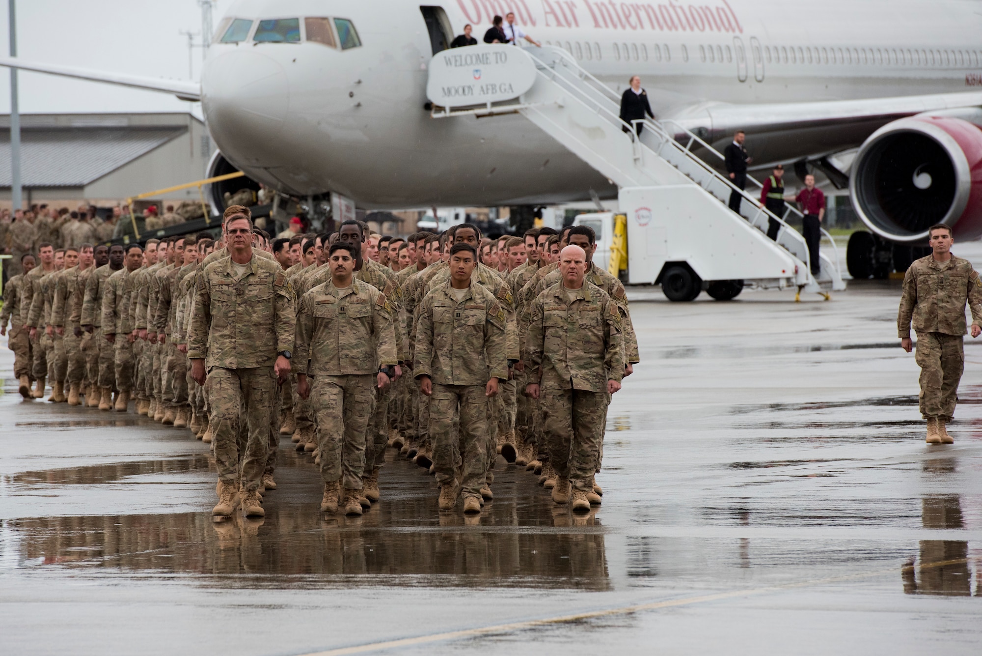 Airmen from the 822nd Base Defense Squadron march to meet family and friends during a redeployment ceremony March 30, 2018, at Moody Air Force Base, Ga. The 822nd BDS returned after spending several months deployed \and earning numerous command, wing and individual awards. (U.S. Air Force photo by Staff Sgt. Eric Summers Jr.)