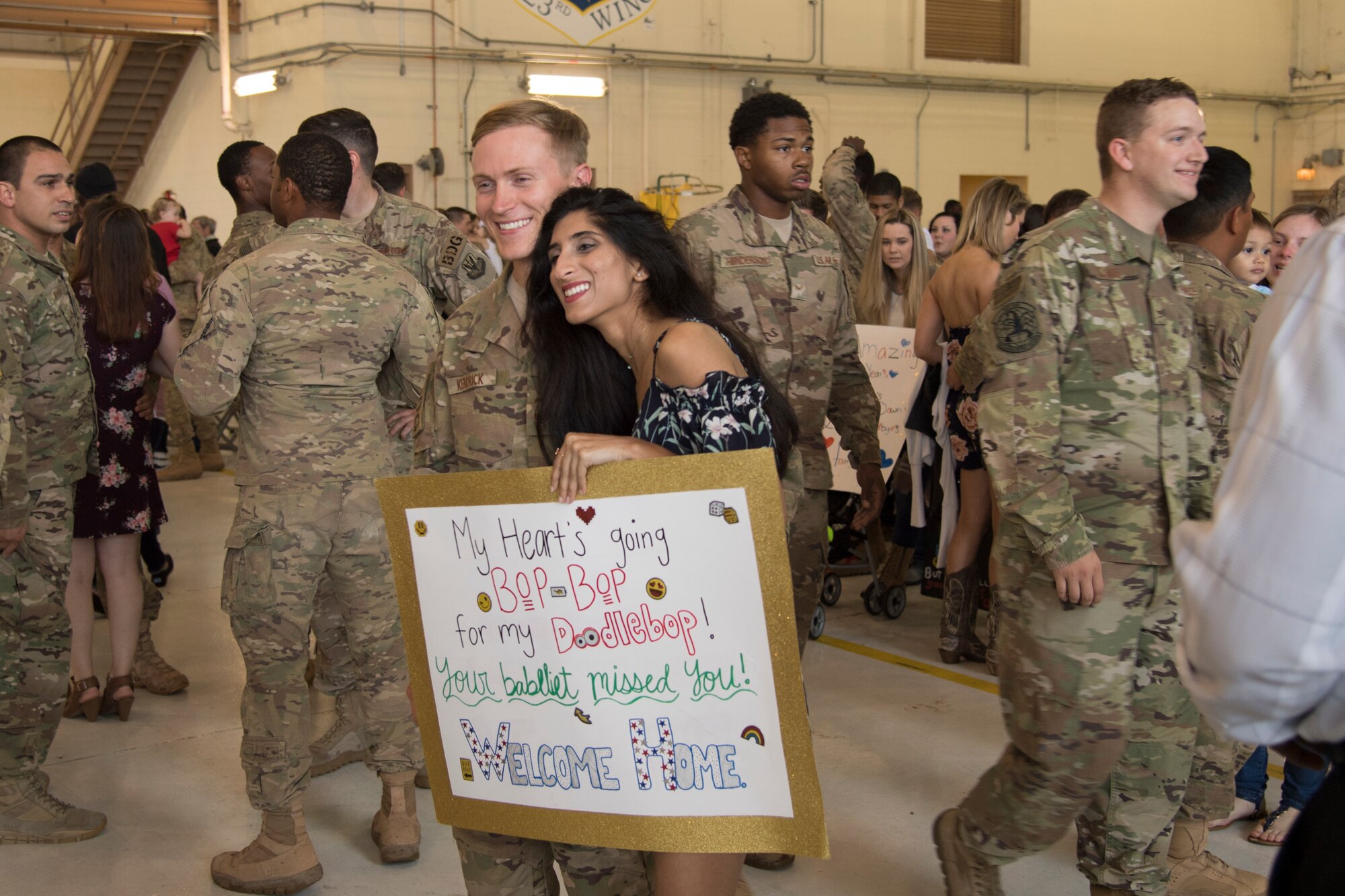 Staff Sgt. Jim Kendrick III, 822nd Base Defense Squadron fire team member, and his girlfriend, May Bhagat, pose for a photo during a redeployment ceremony March 30, 2018. The 822nd BDS returned after spending several months deployed and earning numerous command, wing and individual awards. (U.S. Air Force photo by Staff Sgt. Eric Summers Jr.)