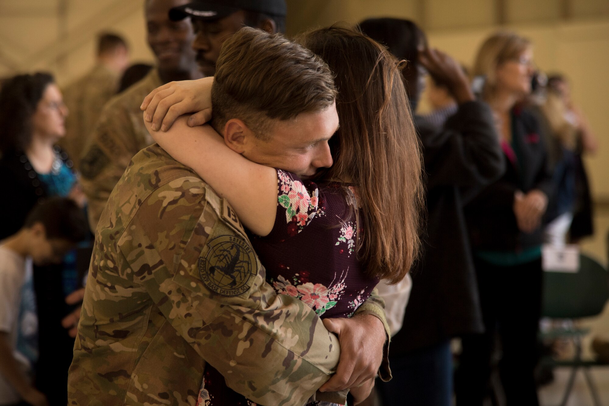 Senior Airman Austin Klewicki, 822nd Base Defense Squadron fire team member, embraces his girlfriend during a redeployment ceremony May 30, 2018, at Moody Air Force Base, Ga. The 822nd BDS returned after spending several months deployed and earning numerous command, wing and individual awards. (U.S. Air Force photo by Staff Sgt. Eric Summers Jr.)