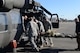 Members of the Association of Military Osteopathic Physicians and Surgeons (AMOPS) load a simulated patient onto a UH-60 Black Hawk helicopter, March 10, 2018, at Joint Base Lewis-McChord, Wash. The AMOPS members were practicing transporting patients to and from military aircraft. (U.S. Air Force photo by Airman 1st Class Sara Hoerichs)