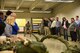 More than 35 business owners and area leaders from Tampa, Florida are given a demonstration by the 41st Aerial Port Squadron air transportation specialists on how a parachute is gathered up after a drop. The civic leaders toured the 403rd Wing at Keesler Air Force Base March 29, 2018. These tours promote community outreach to maintain and foster positive relationships between the local community and the military community. (U.S. Air Force photo by Master Sgt. Jessica Kendziorek)