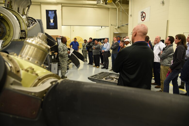 More than 35 business owners and area leaders from Tampa, Florida are briefed by Master Sgt. Donald Maloid, 403rd Maintenance Squadron propulsion technician, on repairs, maintenance and installation of the engines and propellers for the C-130J and WC-130J Super Hercules aircraft during a civic leader tour of the 403rd Wing at Keesler Air Force Base, Mississippi, March 29, 2018. These tours promote community outreach to maintain and foster positive relationships between the local community and the military community. (U.S. Air Force photo by Master Sgt. Jessica Kendziorek)