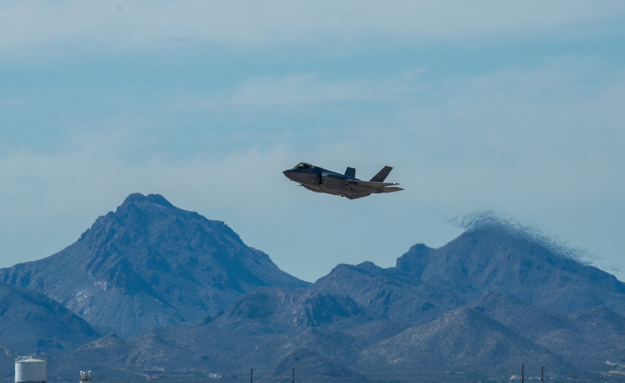 U.S. Air Force Capt. Andrew “Dojo” Olson, F-35 Heritage Flight Team pilot, flies an F-35A Lightning II during the Heritage Flight Training and Certification Course at Davis-Monthan Air Force Base, Ariz., March 1, 2018. During the course, aircrews practice ground and flight training to enable civilian pilots of historic military aircraft and U.S. Air Force pilots of current fighter aircraft to fly safely in formations together. (U.S. Air Force photo by Airman 1st Class Alexander Cook)