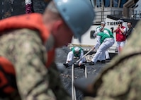 180330-N-LY160-0070 PEARL HARBOR, Hawaii (March 30, 2018) Sailors, assigned to the Virginia-class fast-attack submarine USS Mississippi (SSN 782), prepare to moor pierside in Joint Base Pearl Harbor-Hickam following a six-month Western Pacific deployment, March 30. (U.S. Navy photo by Mass Communication Specialist 2nd Class Michael H. Lee/ Released)