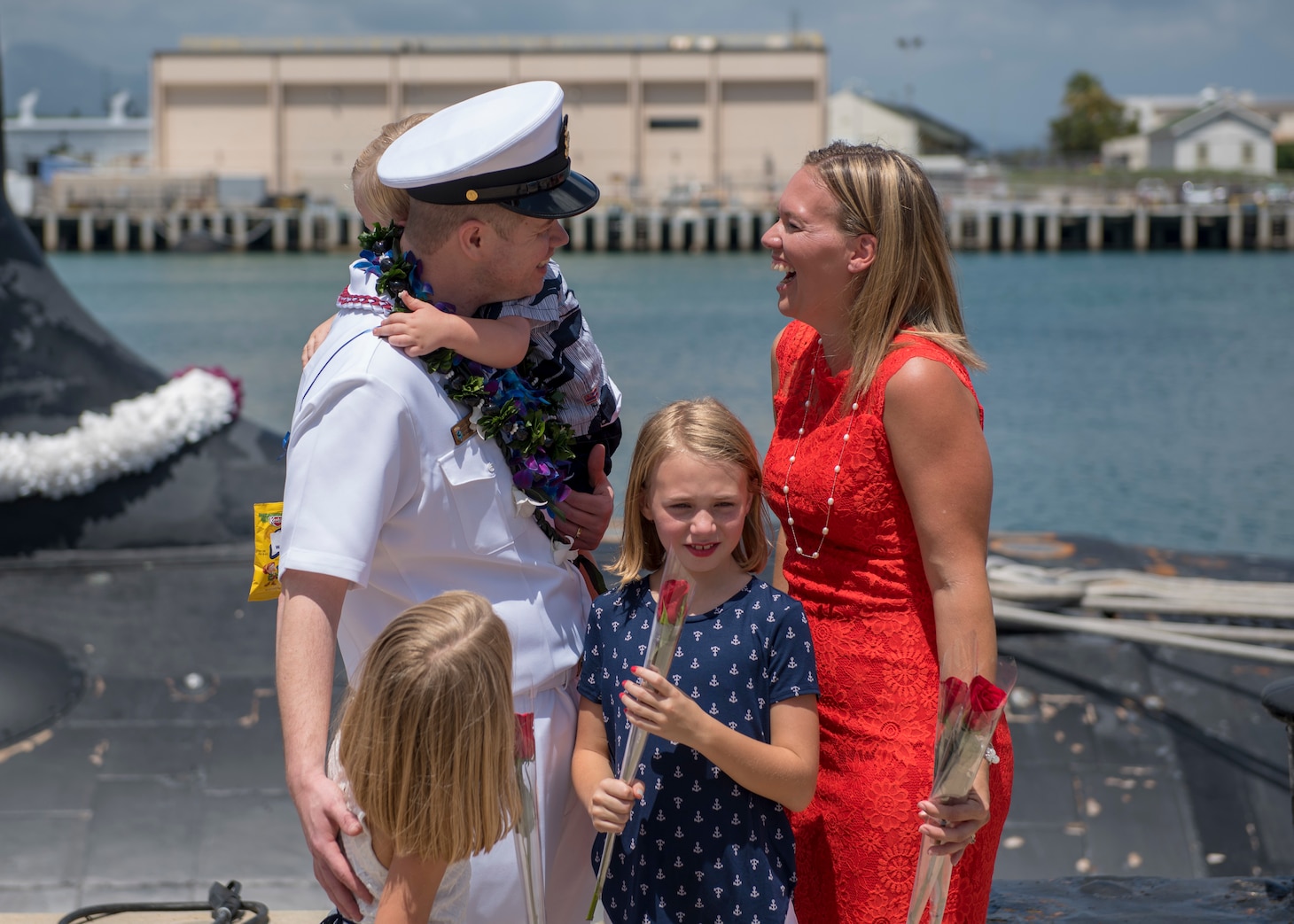 180330-N-LY160-0182 PEARL HARBOR, Hawaii (March 30, 2018) Chief Electronics Technician Nuclear Christopher Fendley, assigned to the Virginia-class fast-attack submarine USS Mississippi (SSN 782), greets his family during a homecoming ceremony in Joint Base Pearl Harbor-Hickam, March 30. Mississippi successfully completed a six-month Western Pacific deployment. (U.S. Navy photo by Mass Communication Specialist 2nd Class Michael H. Lee/ Released)