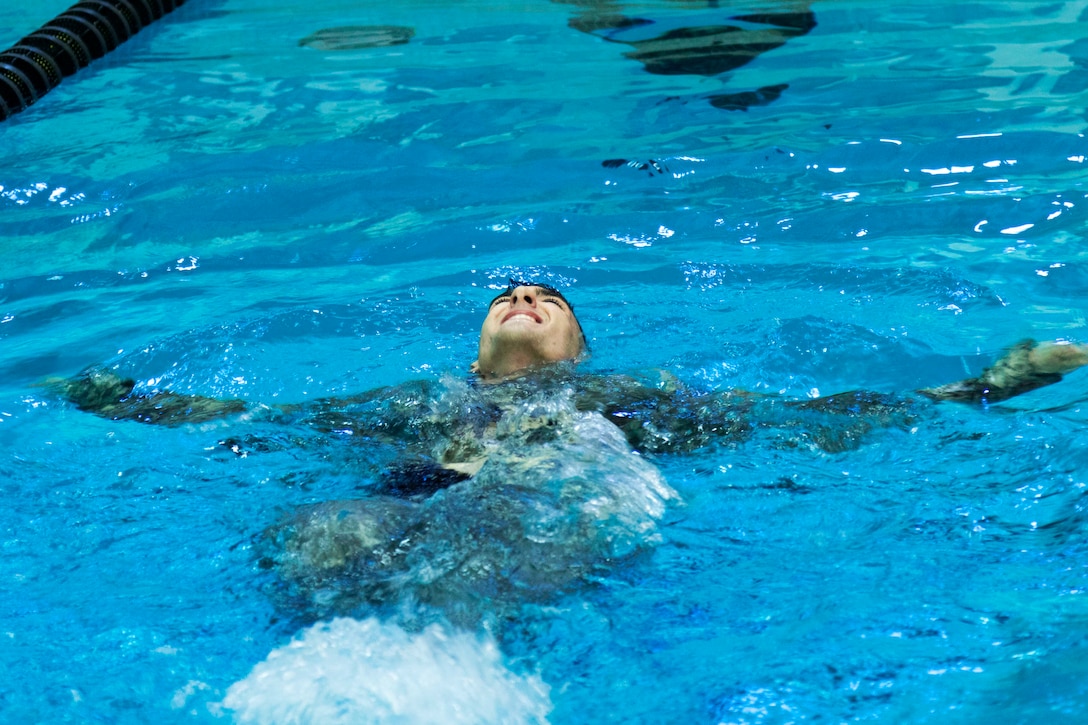 A soldier swims during Army National Guard Best Warrior Competition.