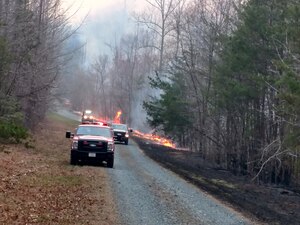 Shown here are Fire fighters conducting controlled burns in order to contain a range fire.