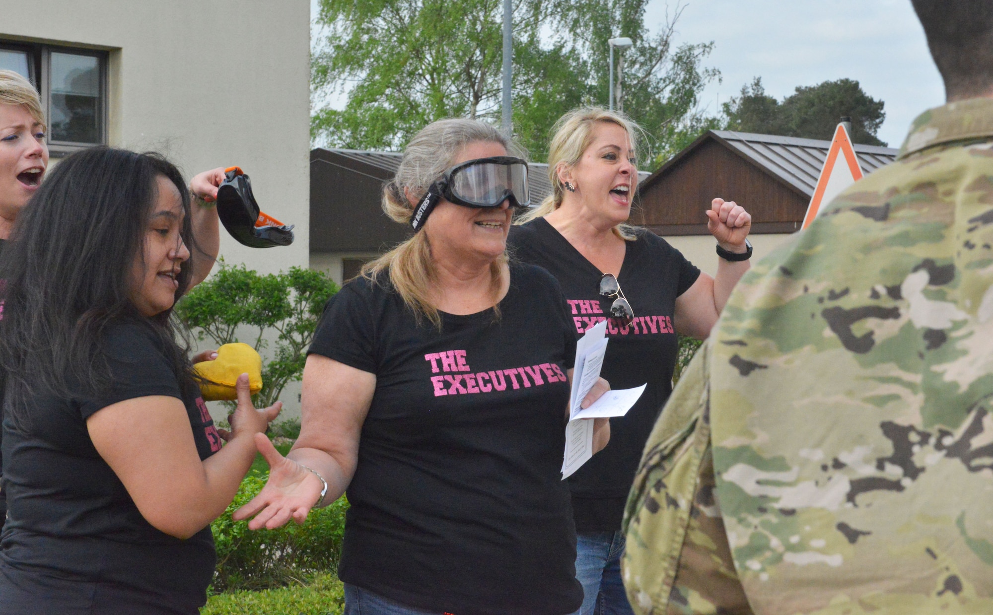 Spouses compete in drunk goggle corn hole during the Amazing Base event on Ramstein Air Base, Germany, Tuesday, April 24, 2018. The purpose of the event was to bring newcomers together to promote camaraderie.