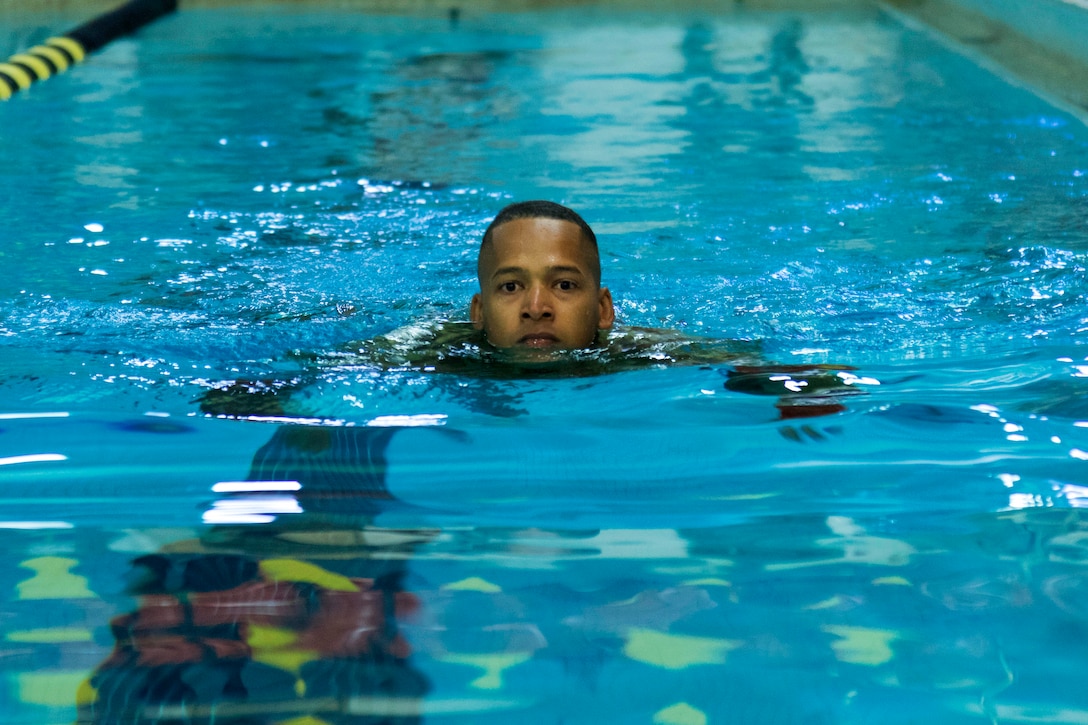 A soldier swims during Army National Guard Best Warrior Competition.