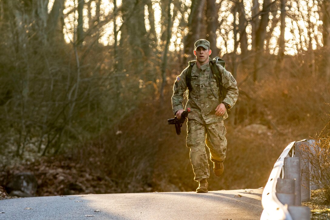 A soldiers competes in the 12-mile ruck march.