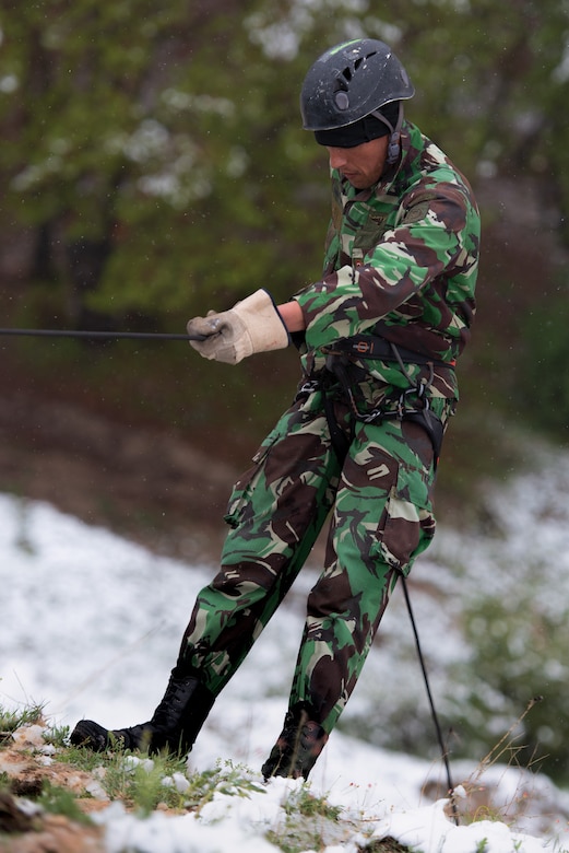 A soldier with the Tajikistan Peacekeeping Battalion of the Mobile Forces practices rappelling at a mountain training camp outside of Dushanbe, Tajikistan, April 18, 2018. This mountain warfare information exchange was part of a larger military-to-military engagement taking place with the Tajikistan Peacekeeping Battalion of the Mobile Forces and the 648th Military Engagement Team, Georgia Army National Guard, involving border security tactics and techniques.