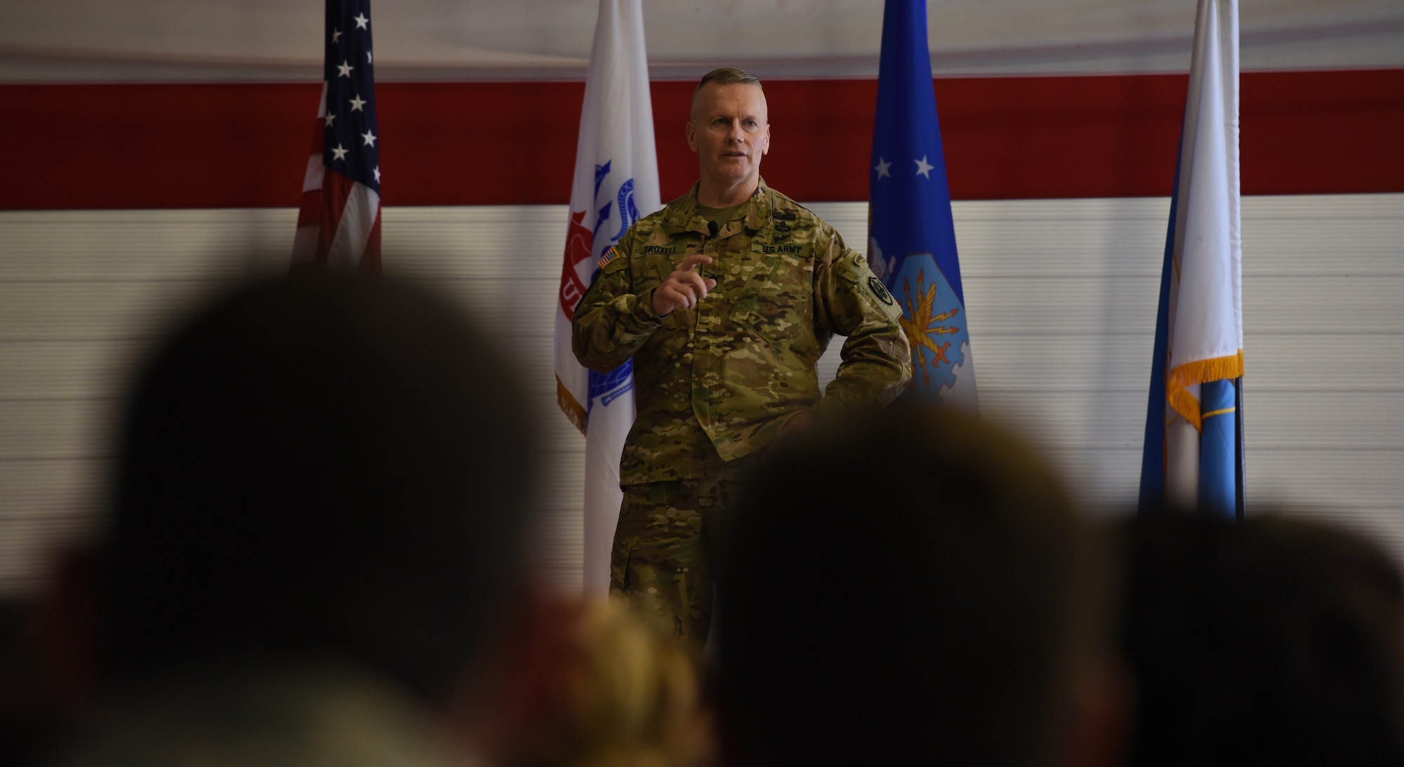 U.S. Army Command Sgt. Maj. John Wayne Troxell, Senior Advisor to the Chairman of the Joint Chiefs of Staff, briefs an all-call.