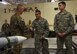 U.S. Army Command Sgt. Maj. John Wayne Troxell, Senior Advisor to the Chairman of the Joint Chiefs of Staff, shakes hand of Airman.