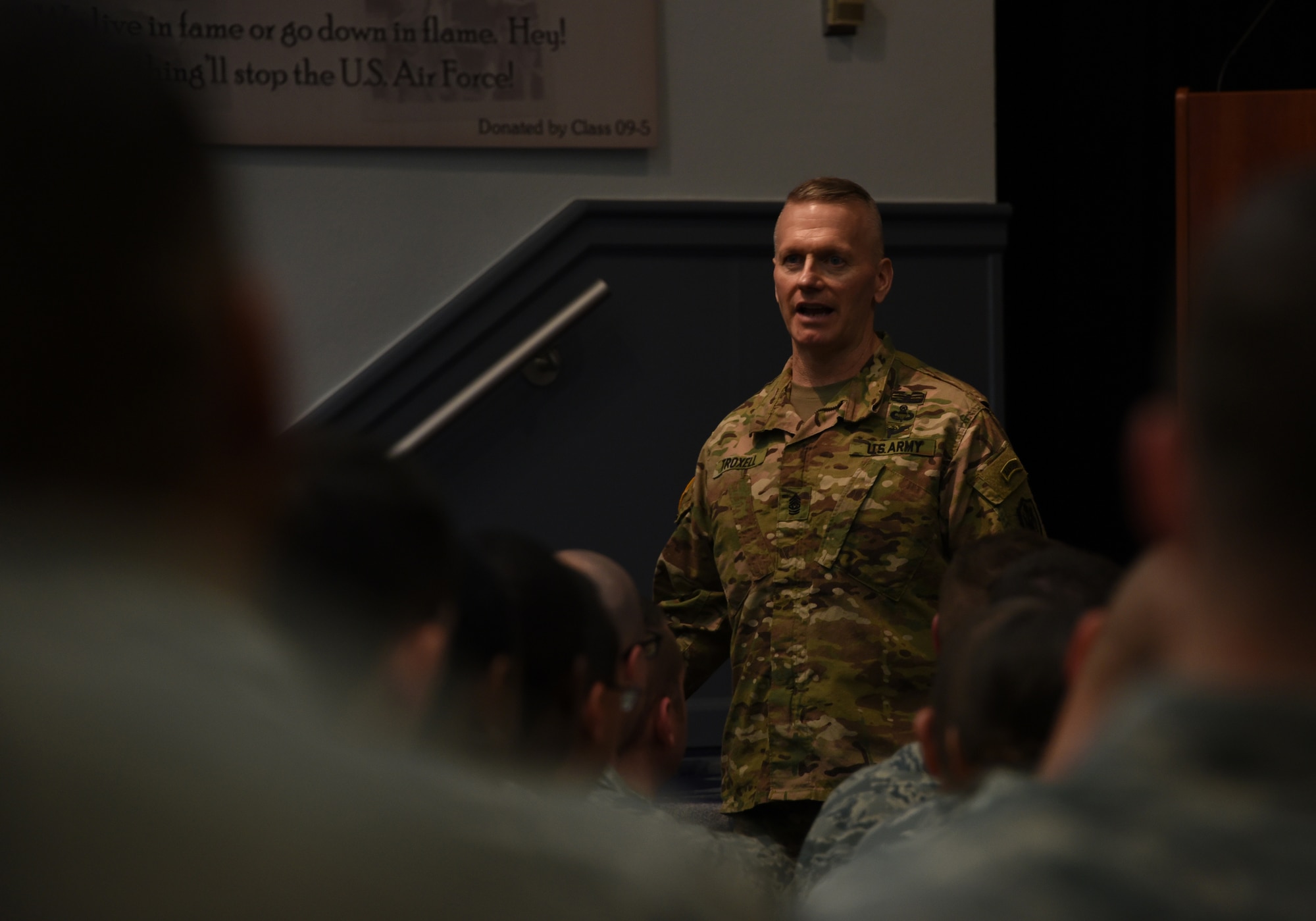 U.S. Army Command Sgt. Maj. John Wayne Troxell, Senior Advisor to the Chairman of the Joint Chiefs of Staff, briefs U.S. Air Force Airmen of the Paul W. Airey NCO Academy.