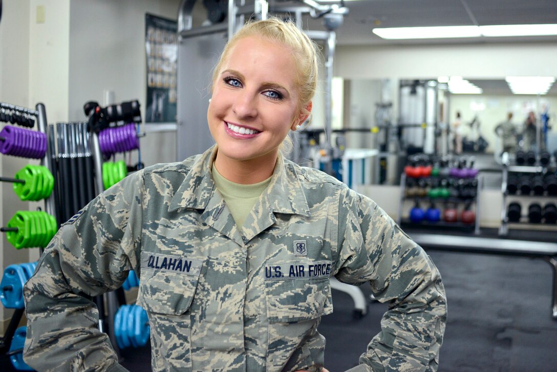 A female airman poses for a photo.
