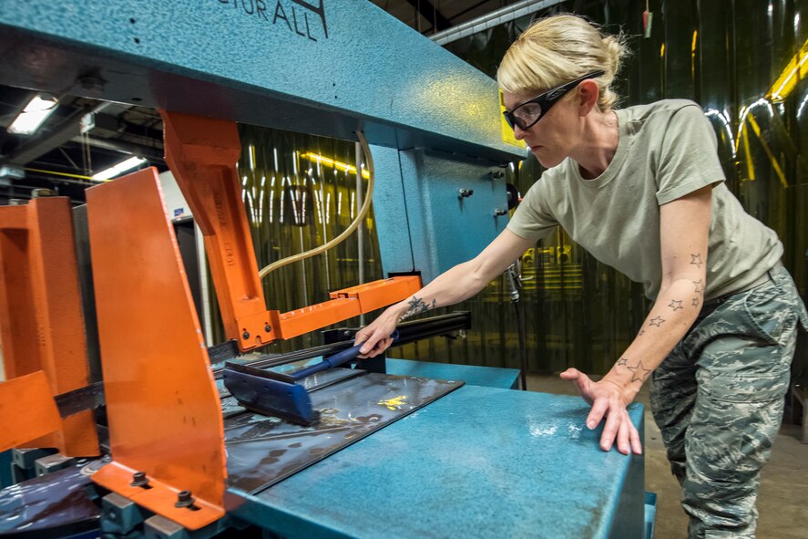 Tech. Sgt. Anna Gee, 476th Maintenance Squadron metals technology shop chief, cleans a horizontal band saw, April 25, 2018, at Moody Air Force Base, Ga. Metals technicians support the mission by utilizing fabrication techniques to repair and overhaul countless tools and aircraft parts. The technicians strive to exercise safe and precise fabrication techniques to be able to sufficiently handle their intense workload. (U.S. Air Force photo by Airman 1st Class Eugene Oliver)