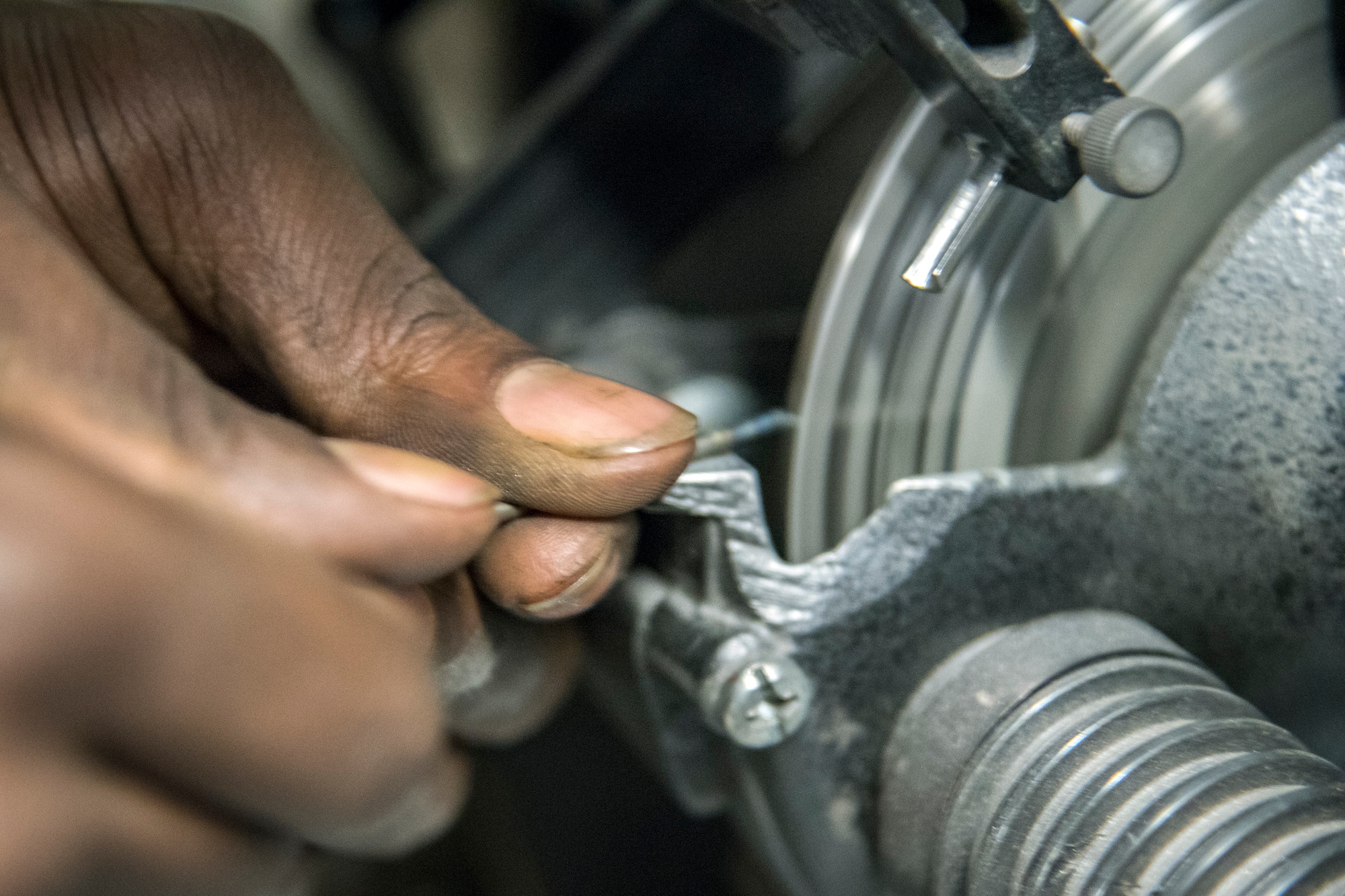 Airman 1st Class Isaiah Jackson, 23d Maintenance Squadron aircraft metals technology journeyman, sharpens a piece of aluminum, April 25, 2018, at Moody Air Force Base, Ga. Metals technicians support the mission by utilizing fabrication techniques to repair and overhaul countless tools and aircraft parts. The technicians strive to exercise safe and precise fabrication techniques to be able to sufficiently handle their intense workload. (U.S. Air Force photo by Airman 1st Class Eugene Oliver)