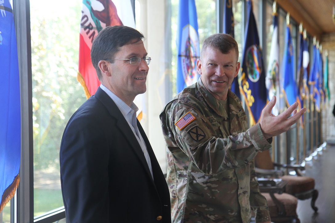 Army Lt. Gen. Jeffrey S. Buchanan, commander of U.S. Army North, speaks with Army Secretary Mark T. Esper at Fort Sam Houston, Texas.