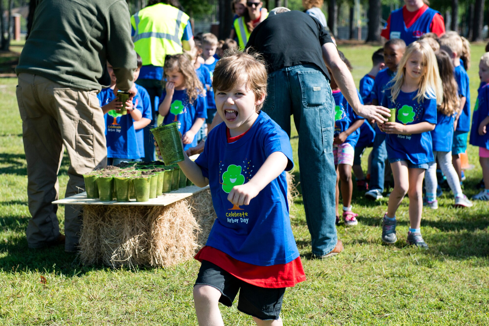 A child from Moody’s child development center brings dirt to an oak tree hole during Arbor Day, April 27, 2018, at Moody Air Force Base, Ga. Moody annually celebrates the holiday which encourages the benefits of planting trees. For 19 years the base has been a part of the Tree City USA Program by the National Arbor Day Foundation, to better prepare for the future of caring for their Airmen through improved ecological sustainability. (U.S. Air Force photo by Airman 1st Class Erick Requadt)